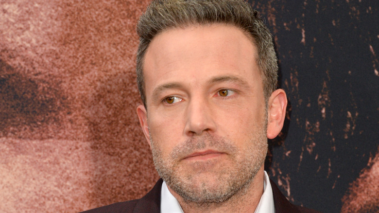 Ben Affleck peering to the side, straight-faced