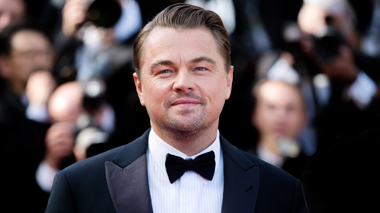 Leonardo DiCaprio wears a tuxedo and bow tie.