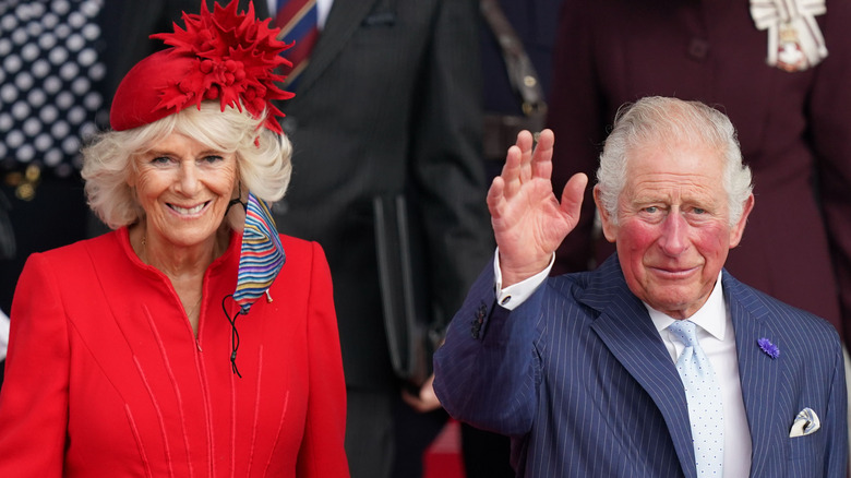 Camilla Parker Bowles and Prince Charles greeting crowds