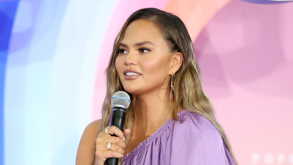 Chrissy Teigen in purple