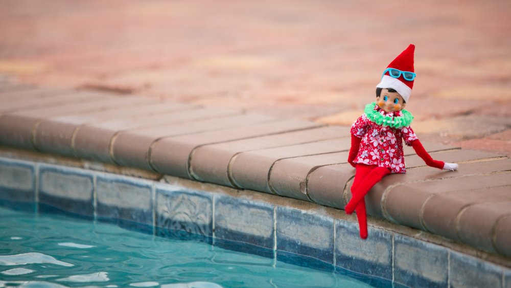 elf on a shelf by the pool