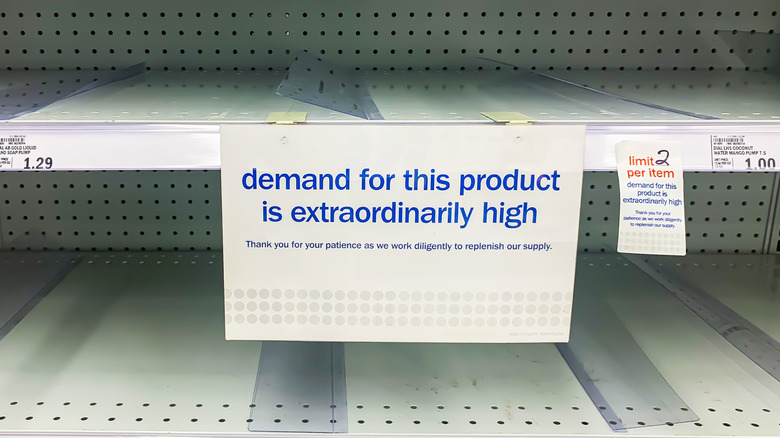 Supermarket shelves with sold-out signage