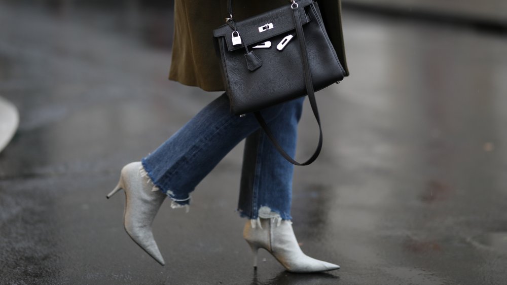 Fashionable woman in denims wearing heels