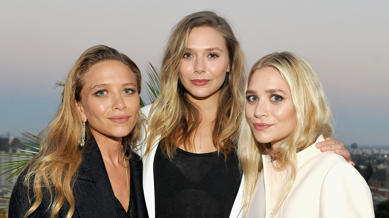 Elizabeth Olsen with Mary-Kate and Ashley Olsen