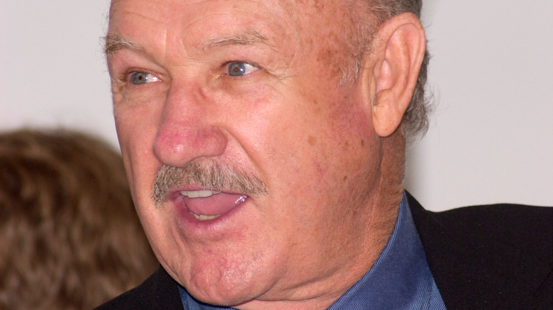 Gene Hackman smiling away from camera