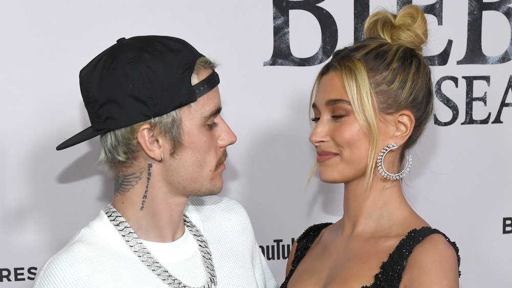 Justin Bieber looking at Hailey Baldwin