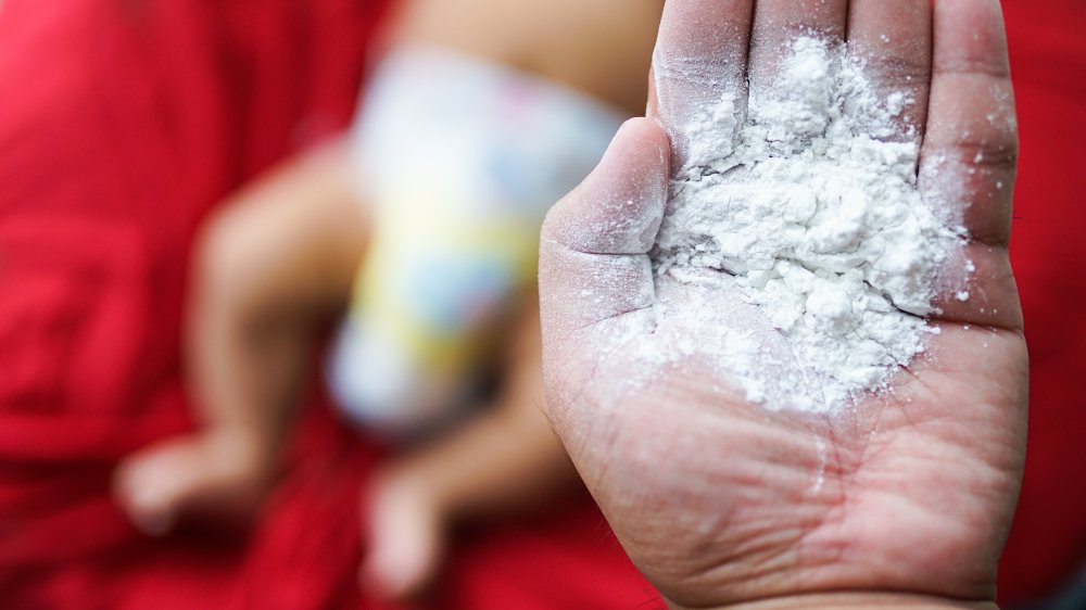 Diapered baby with talcum powder 