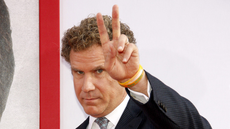 Will Ferrell throwing up the peace sign