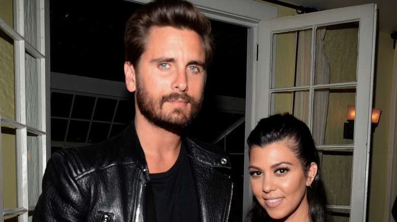 Kourtney Kardashian and Scott Disick pose for a photo together. 