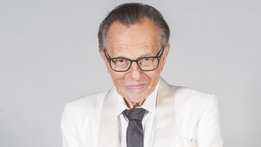 Larry King posing for a photograph