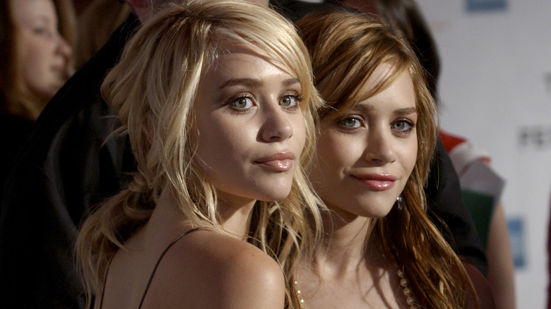 Ashley and Mary-Kate Olsen on red carpet at event