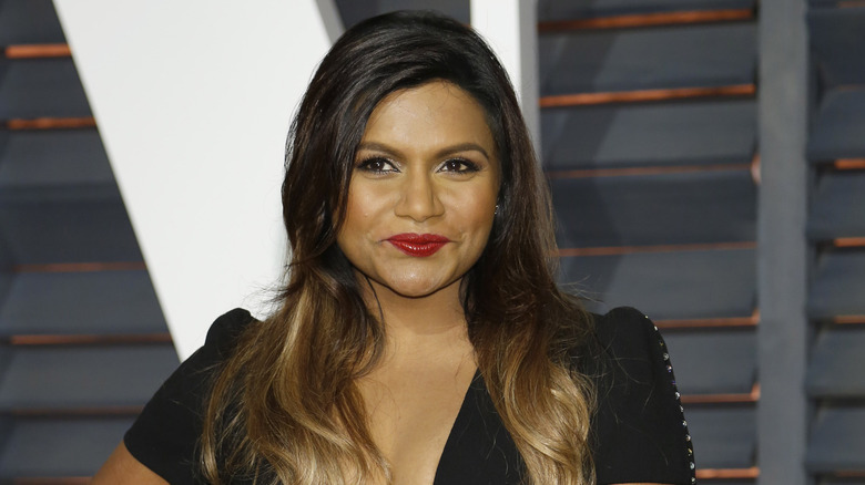 Mindy Kaling wears black plunging dress on red carpet