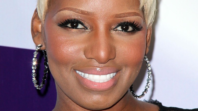 NeNe Leakes with short hair and hoop earrings