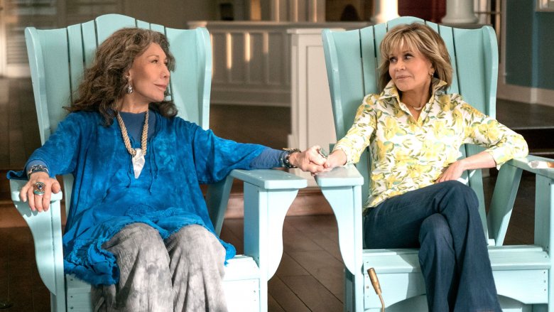 Lily Tomlin and Jane Fonda holding hands in Grace and Frankie
