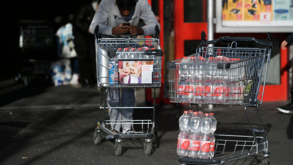 man shopping for bottled water