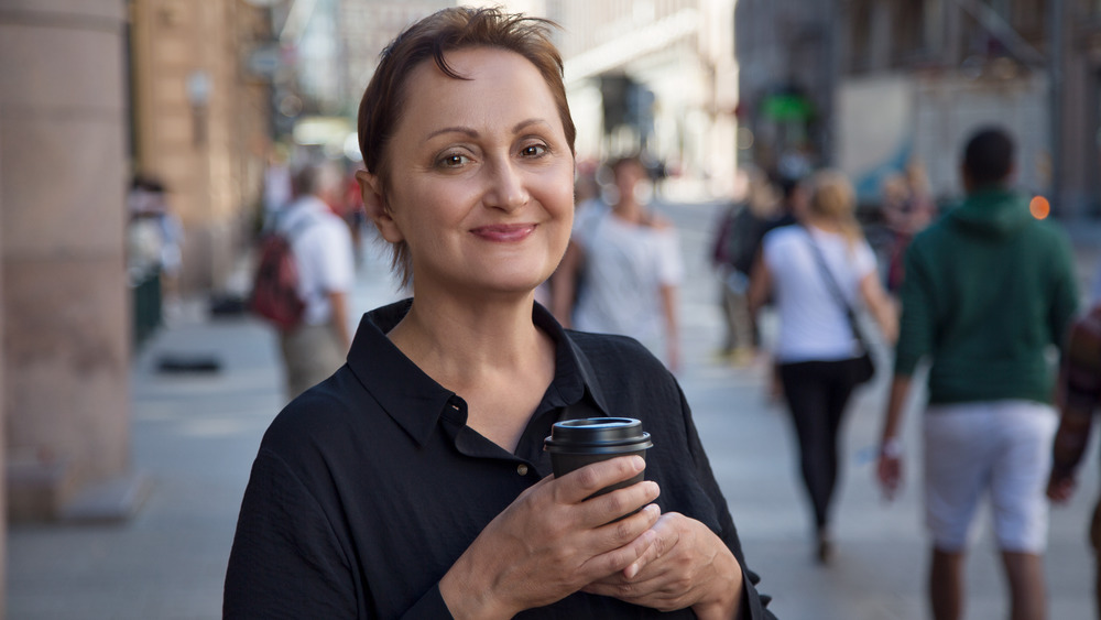 Woman on her own in crowded city