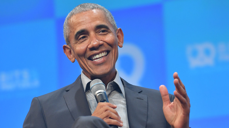 Barack Obama laughs onstage