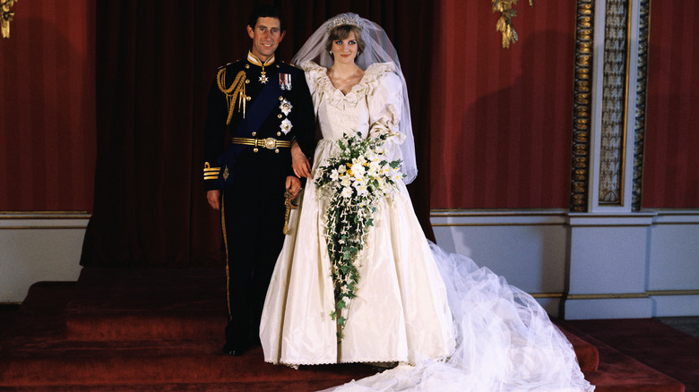 Princess Diana posing in her wedding gown 