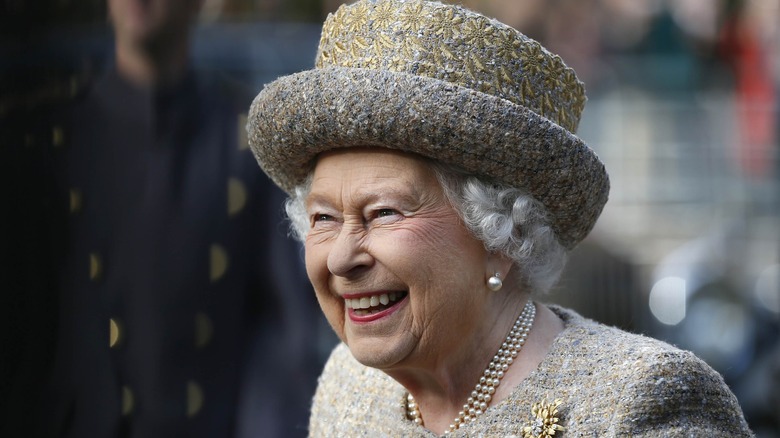 Queen Elizabeth smiling in hat