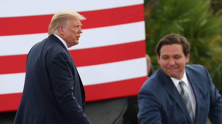 Trump and Desantis in front of the flag