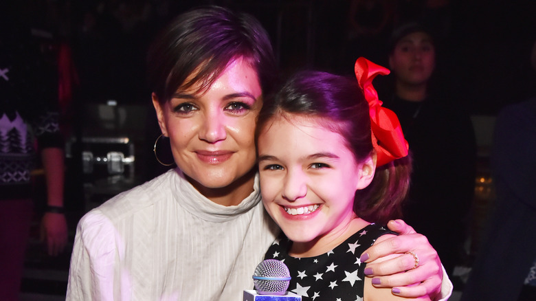 Suri Cruise cuddles up to mom Katie Holmes