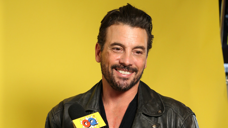 Skeet Ulrich wears a leather jacket at an event.