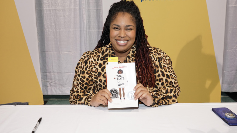 Author Angie Thomas with book