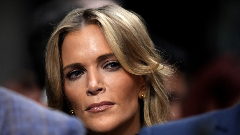 Megyn Kelly stares left, with a stern look