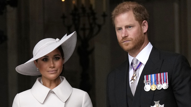 Meghan Markle and Prince Harry look downtrodden at the Platinum Jubilee