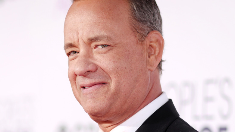 Tom Hanks poses at an event