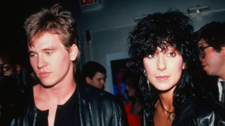 Cher and Val Kilmer walking while dressed in all black