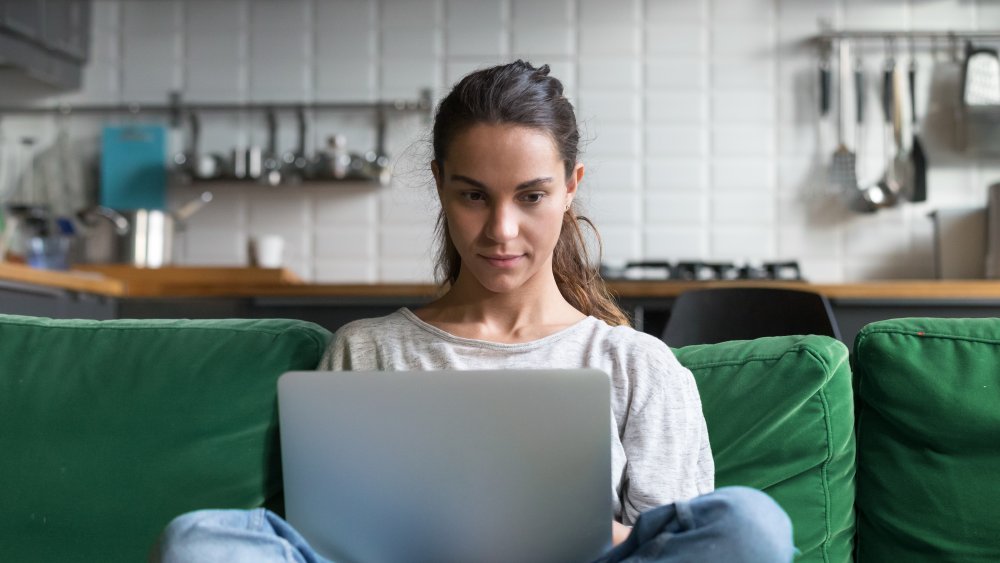 Woman on a lap top on the couch