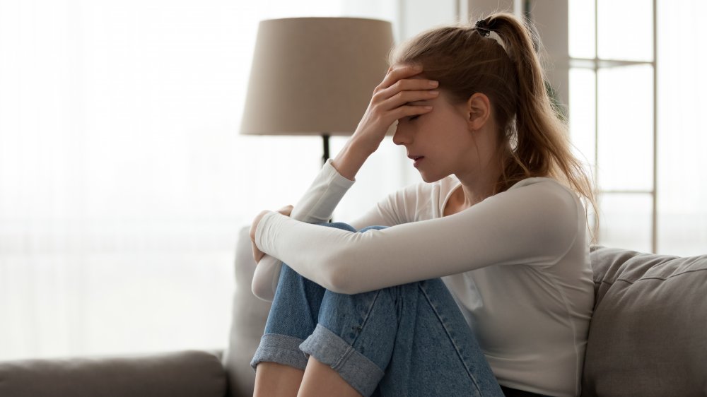 Woman frustrated on the couch