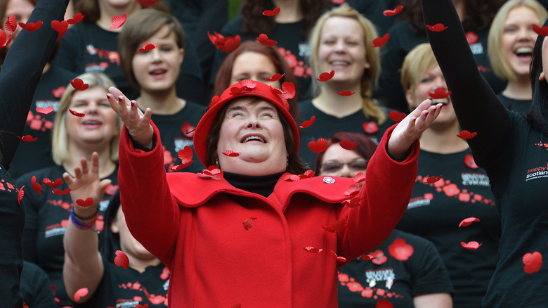 Susan Boyle with red flower petals