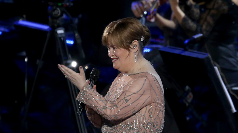 Susan Boyle holding a microphone