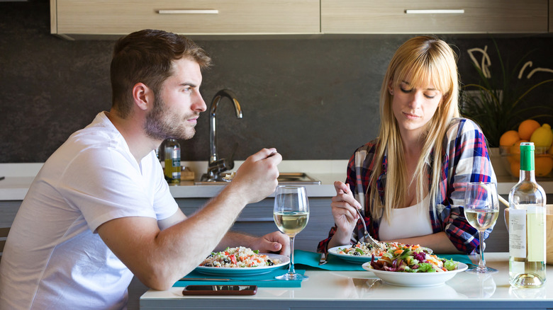 couple eating dinner without talking