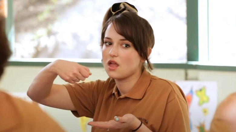 Milana Vayntrub miming eating with a fork