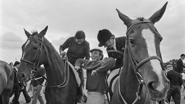 Princess Anne and Mark Phillips on horses