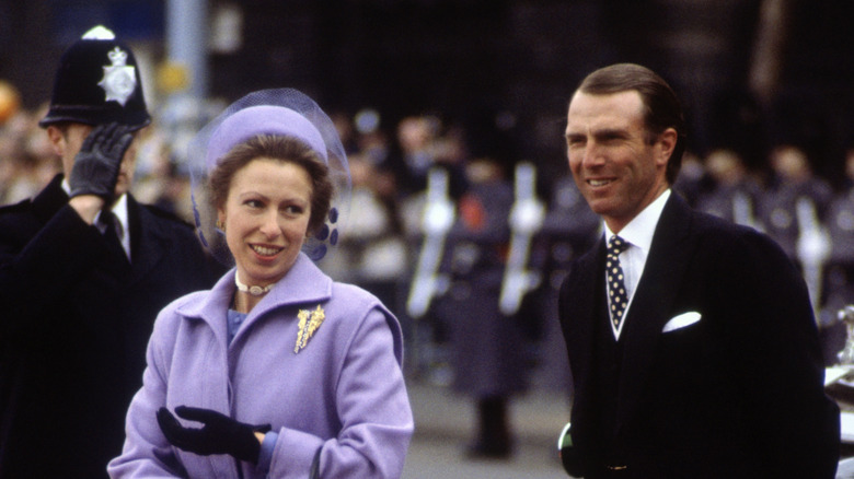 Princess Anne and Mark Phillips smiling at an event