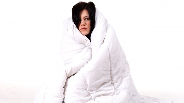 woman wrapped in blanket