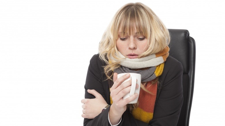 cold woman in office