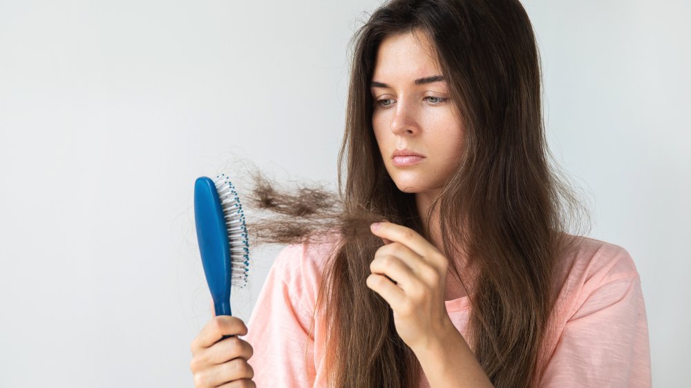 woman losing hair