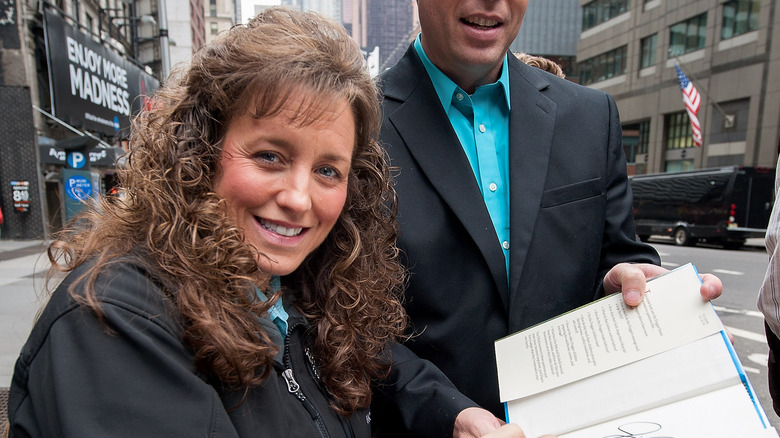 Michelle Duggar signing an autograph