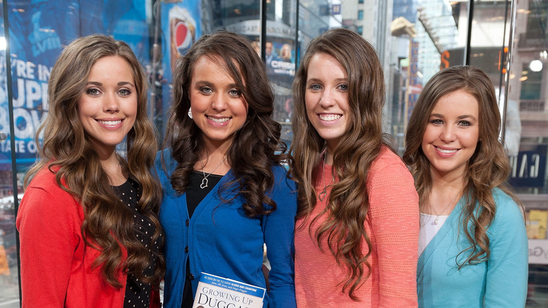 Four of the Duggar daughters smiling