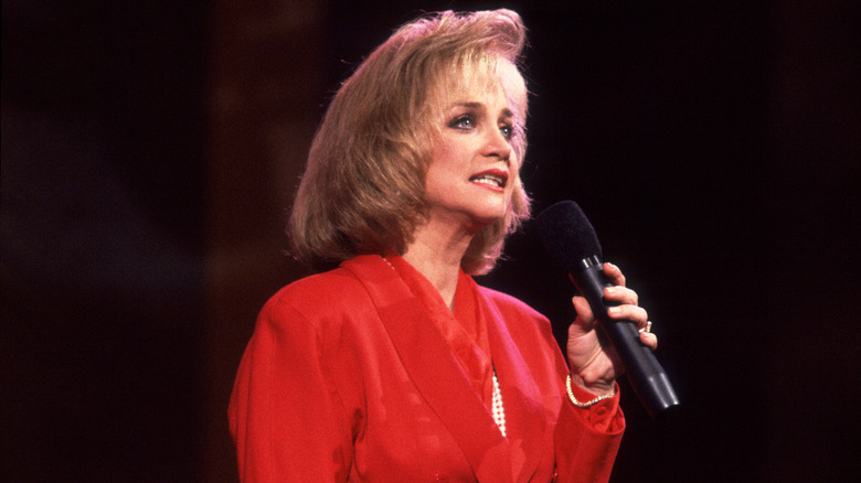 Barbara Mandrell holding microphone