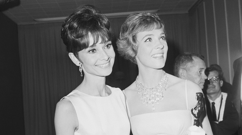 Julie Andrews smiling with Audrey Hepburn 