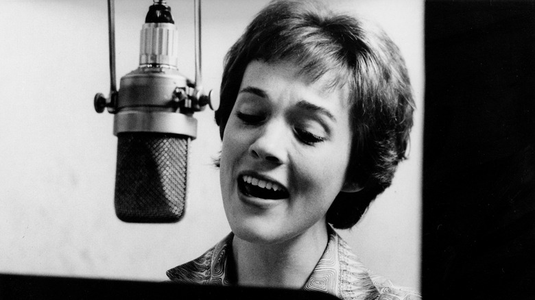 Julie Andrews singing into an inverted tube microphone