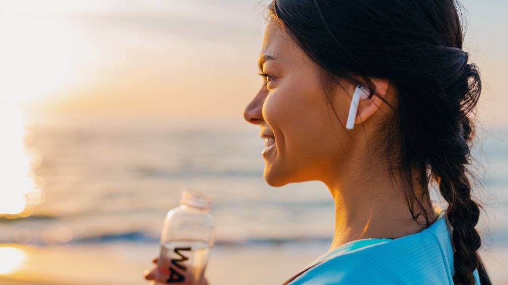 Woman wearing earbuds