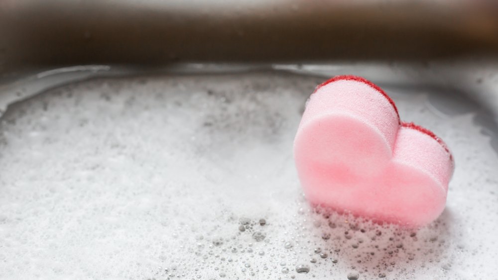 Pink sponge in the kitchen sink