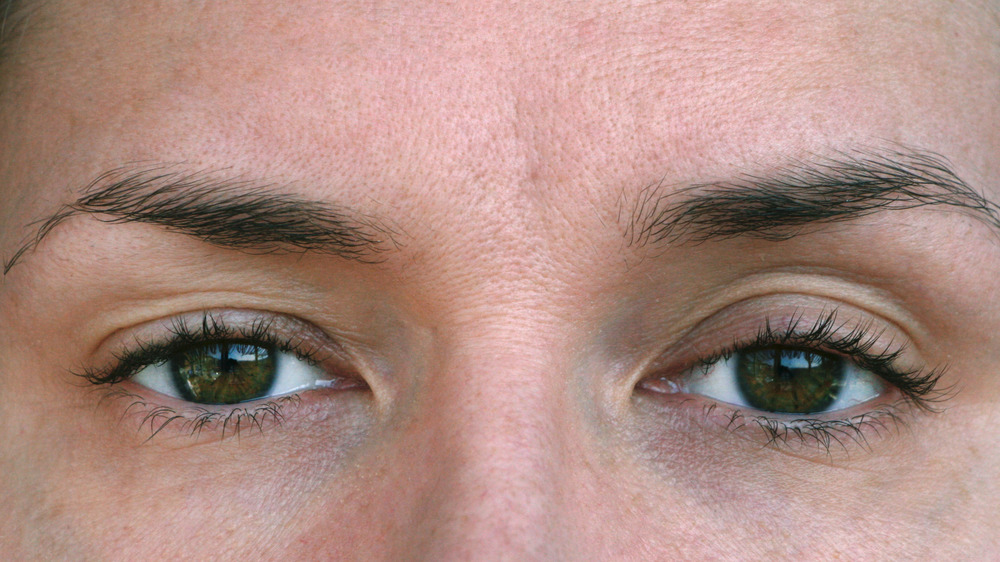 Close-up of woman with slightly droopy eyelids